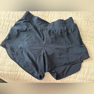 True navy hotty hot 4” high rise lined short